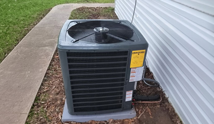 A newly installed central air conditioner outdoor compressor unit