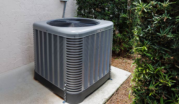 An installed outdoor AC condenser unit