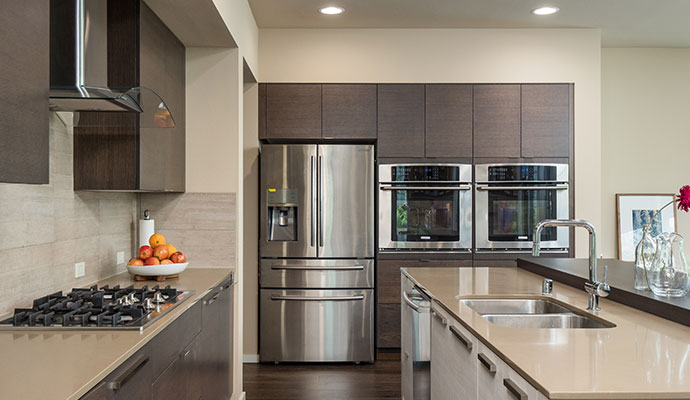 Kitchen with stainless refrigerator