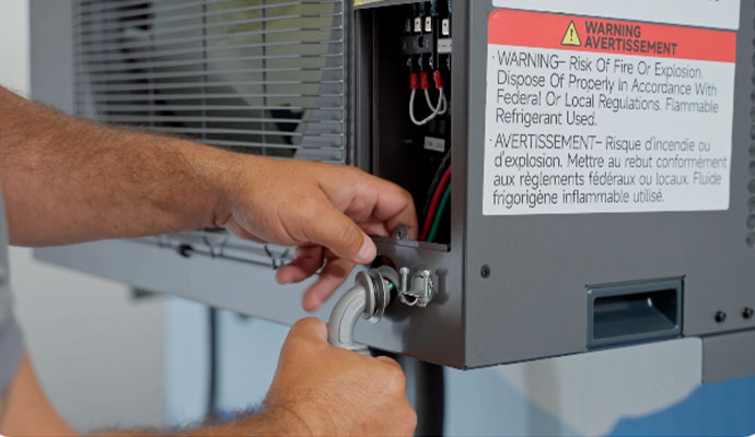Technician working on HVAC wiring
