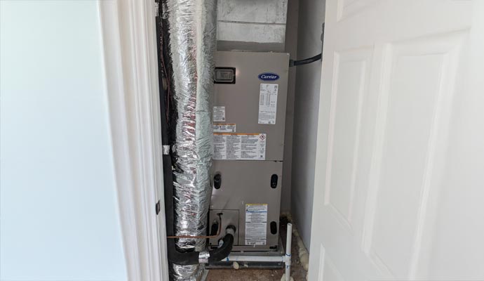Carrier HVAC unit installed in utility closet