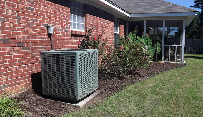 Installed outdoor HVAC unit in residential backyard